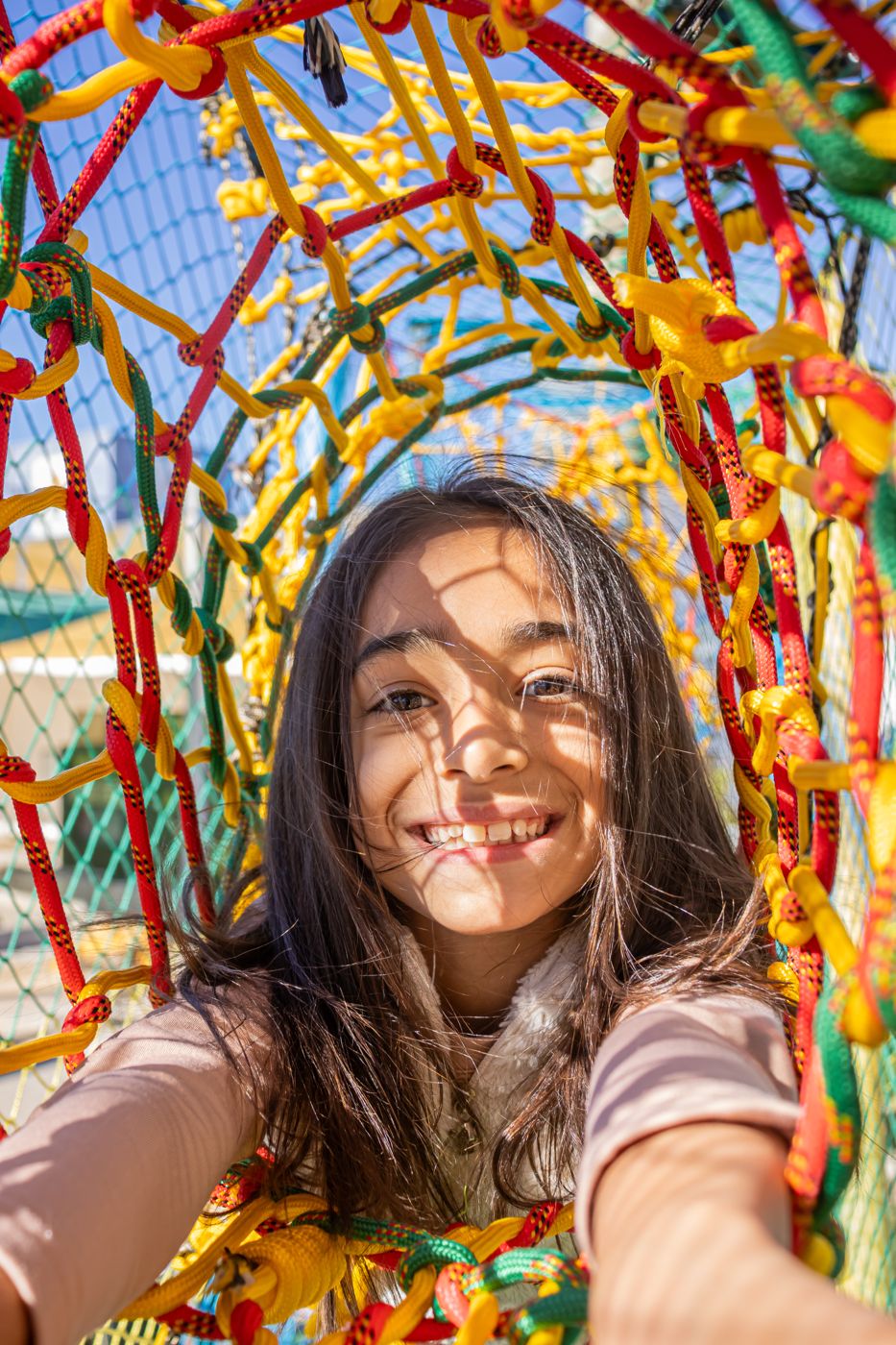 Menina sorrindo no Arvorismo do Dudinha